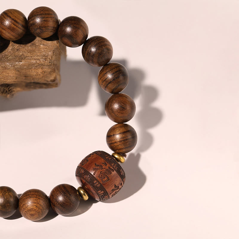 Bracelet spirituel en bois de rose avec le symbole Fu | Chaleur et chance