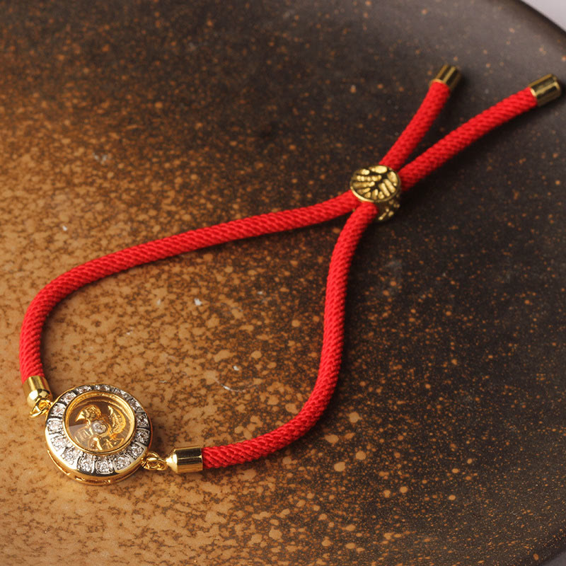 Bracelet de foi en fil rouge avec moulin à vent rotatif en cuivre et laiton