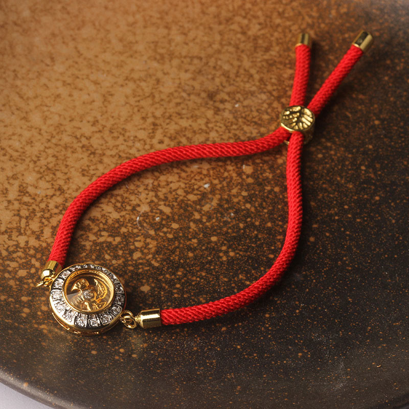 Bracelet de foi en fil rouge avec moulin à vent rotatif en cuivre et laiton