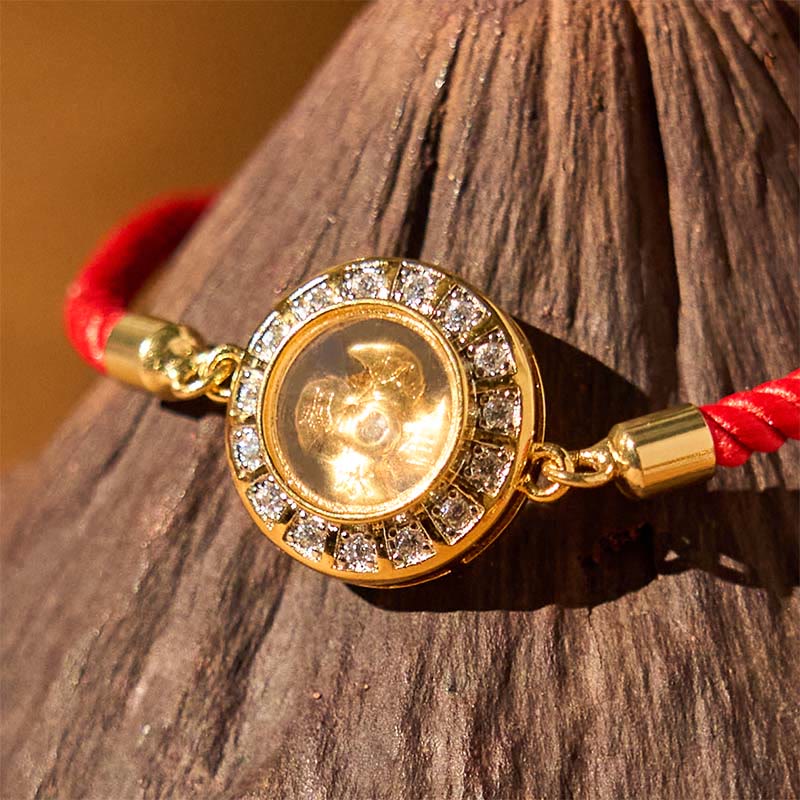 Bracelet de foi en fil rouge avec moulin à vent rotatif en cuivre et laiton