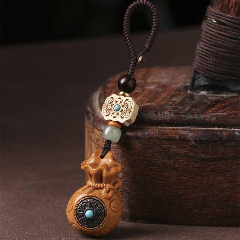 Porte-clés et suspension de téléphone en bois de santal Om Mani Padme Hum