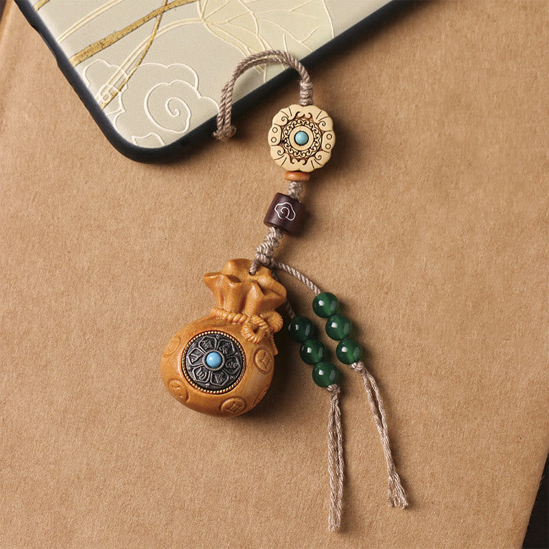 Porte-clés et suspension de téléphone en bois de santal Om Mani Padme Hum
