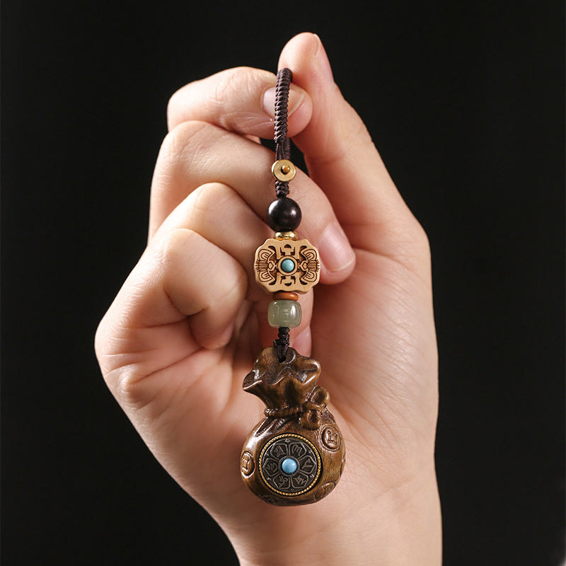 Porte-clés et suspension de téléphone en bois de santal Om Mani Padme Hum