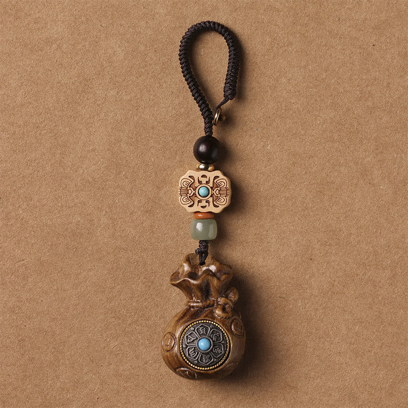 Porte-clés et suspension de téléphone en bois de santal Om Mani Padme Hum