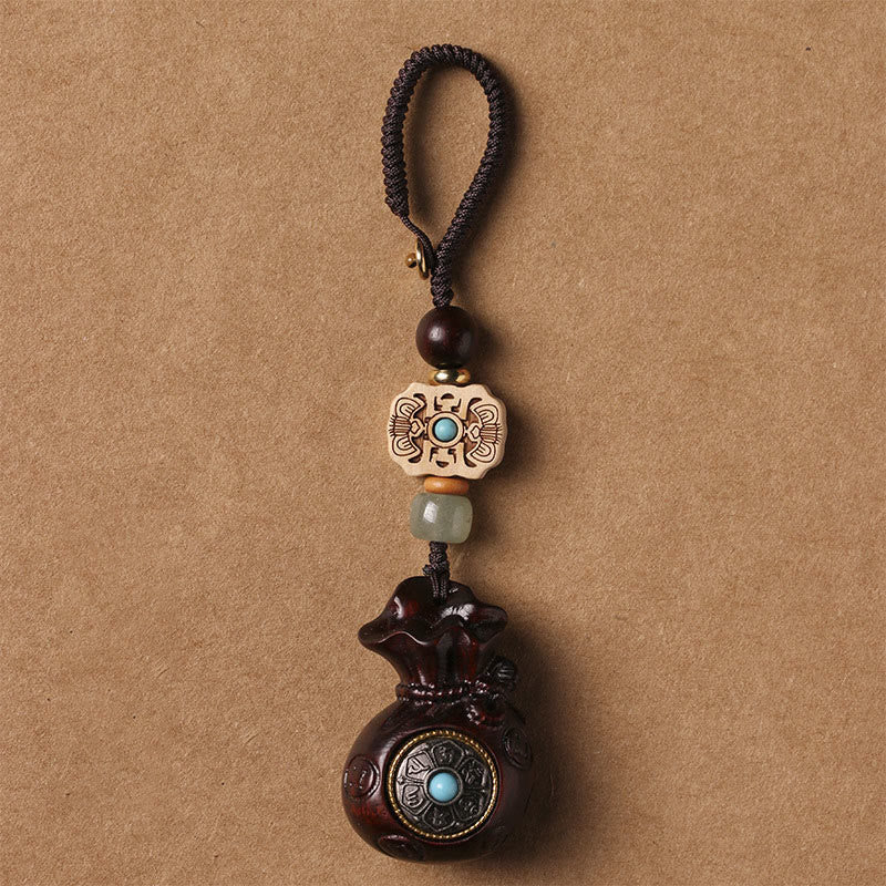 Porte-clés et suspension de téléphone en bois de santal Om Mani Padme Hum