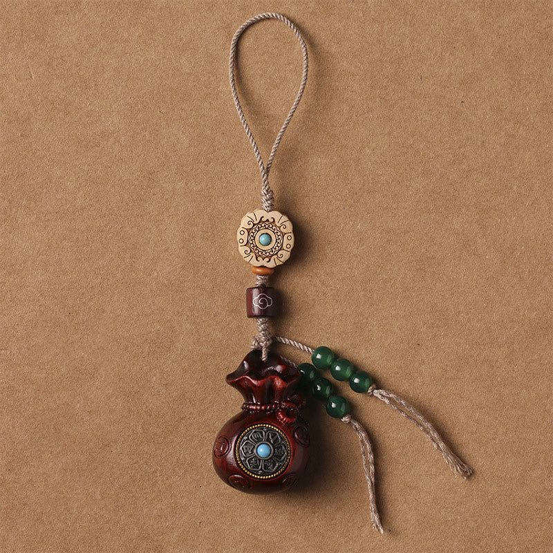 Porte-clés et suspension de téléphone en bois de santal Om Mani Padme Hum