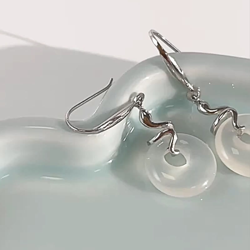 Boucles d'oreilles en argent et calcédoine avec boucle de paix