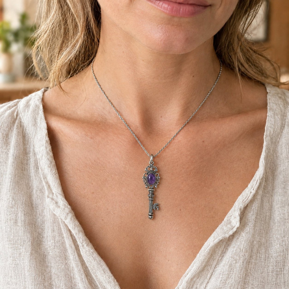 Silver Crystal Key Pendant with Healing Gemstones 65mm, worn on the neck by a woman