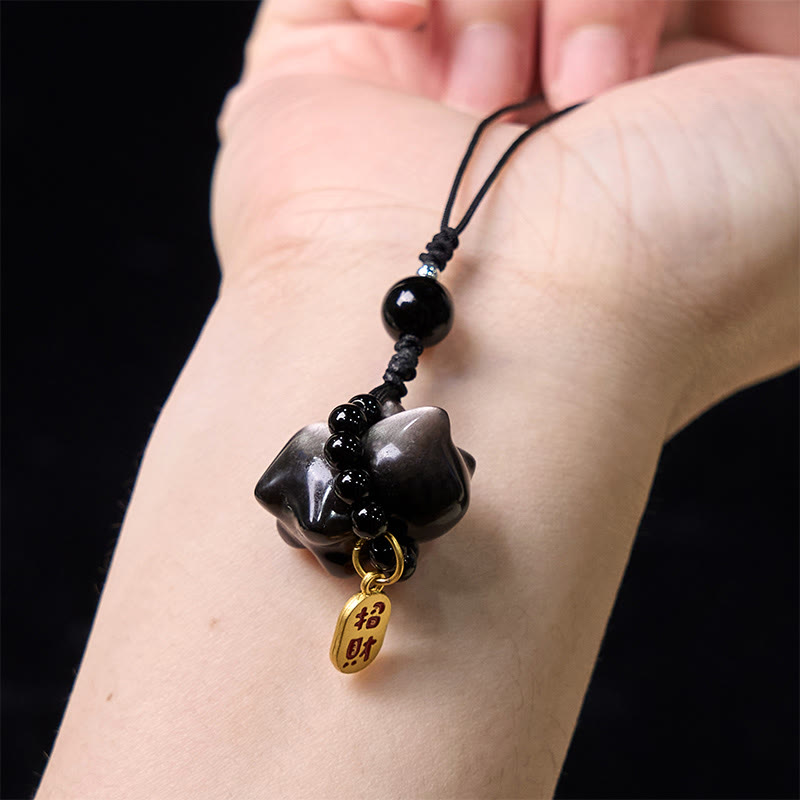 Porte-clés de protection en obsidienne argentée avec le personnage Fu