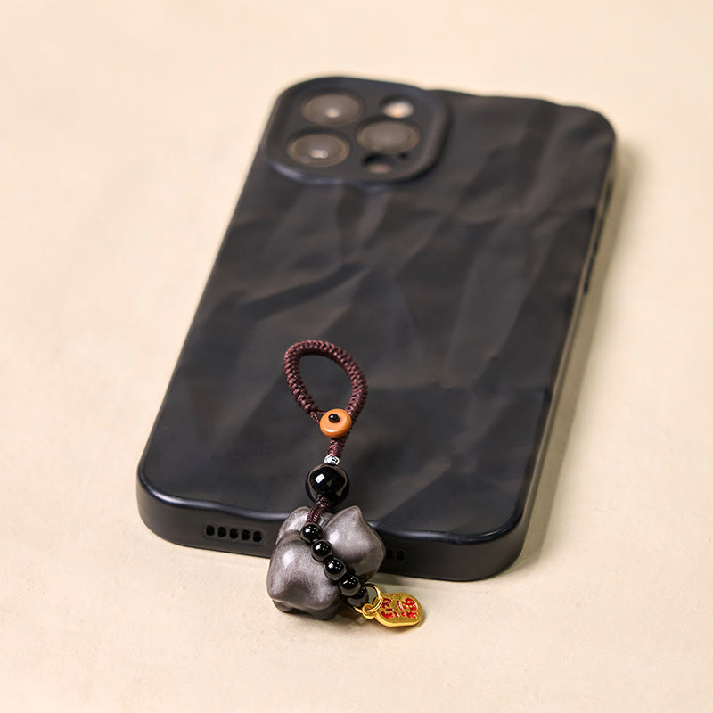 Porte-clés de protection en obsidienne argentée avec le personnage Fu
