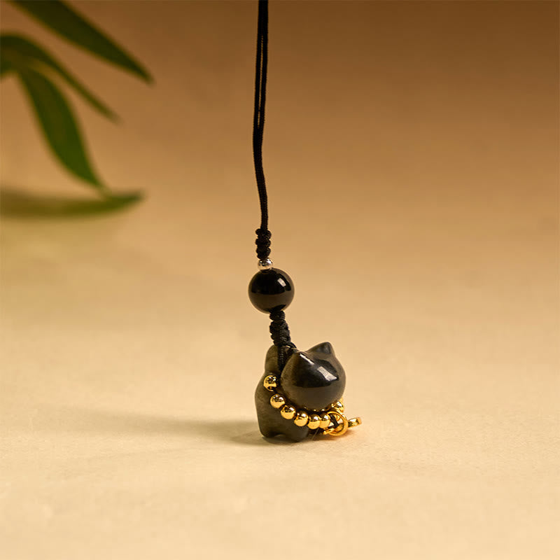 Porte-clés de protection en obsidienne argentée avec le personnage Fu