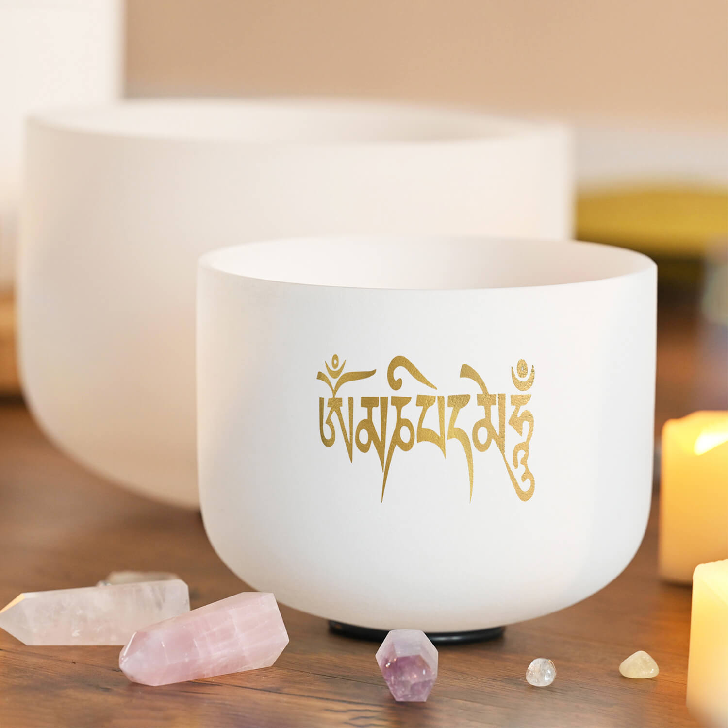 White ceramic singing bowl with golden Sanskrit text inscription for meditation