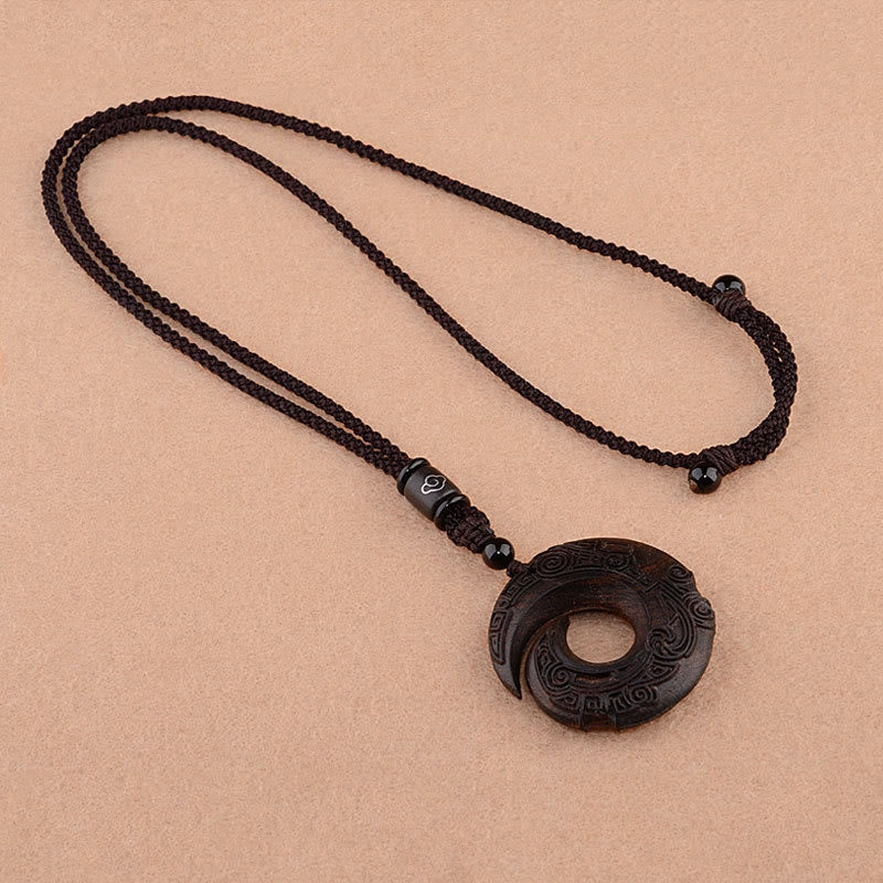Collier de protection spirituelle en bois d'ébène et bois de santal rouge à petites feuilles