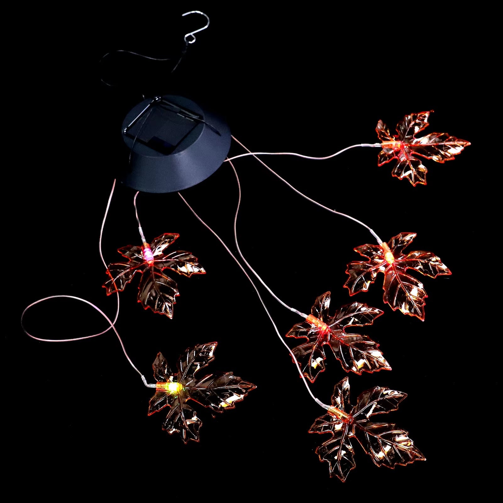 Solar-powered string lights with copper maple leaves for Halloween decor