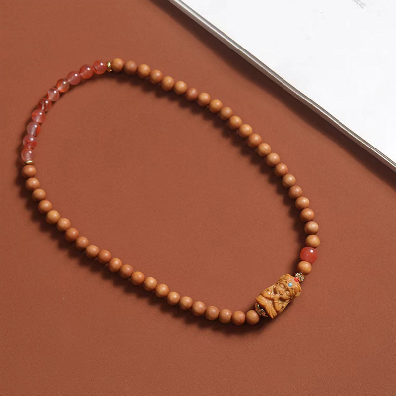 Bracelet en agate rouge du Sud et bois de santal pour la richesse et la protection