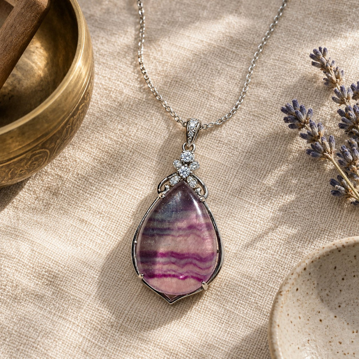 Sterling Silver Amethyst Pendant for Healing & Meditation, styled with a singing bowl and lavender