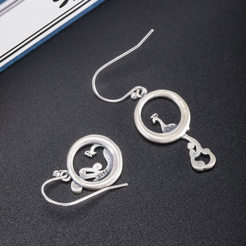 Boucles d'oreilles spirituelles en argent sterling avec motif paon