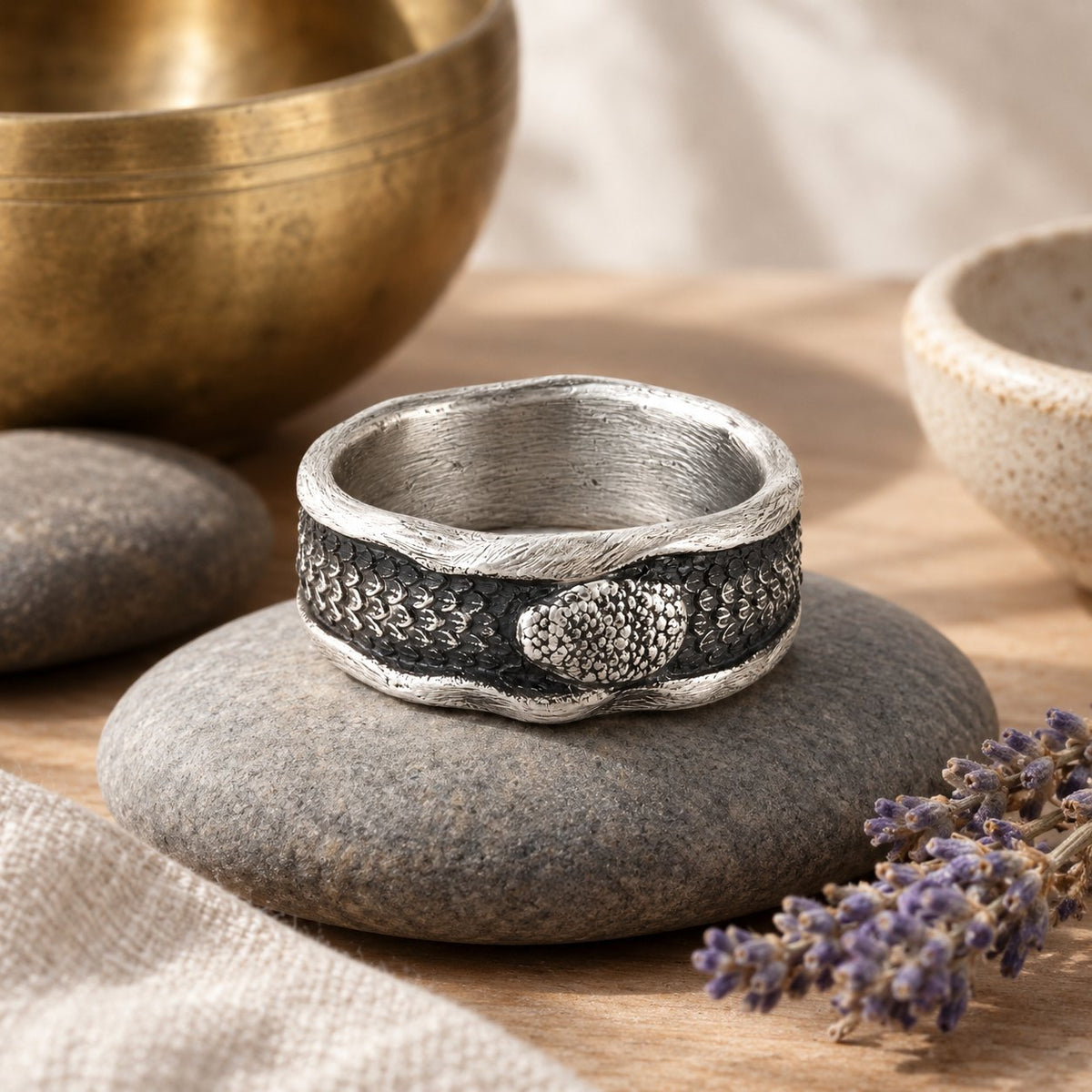999 Sterling Silver Snake Protection Ring for Wisdom & Resilience, styled with a singing bowl and lavender