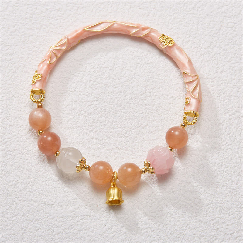 Bracelet à breloques positives en pierre de soleil et jade de soie dorée