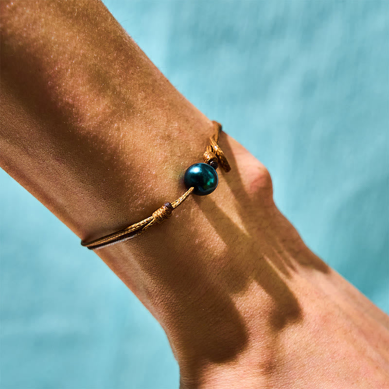 Bracelet de guérison en perles noires de Tahiti sur corde cirée 14-19 cm