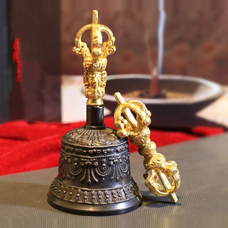 Ornate Tibetan ritual bell with golden vajra handle in Meditation Bell Set