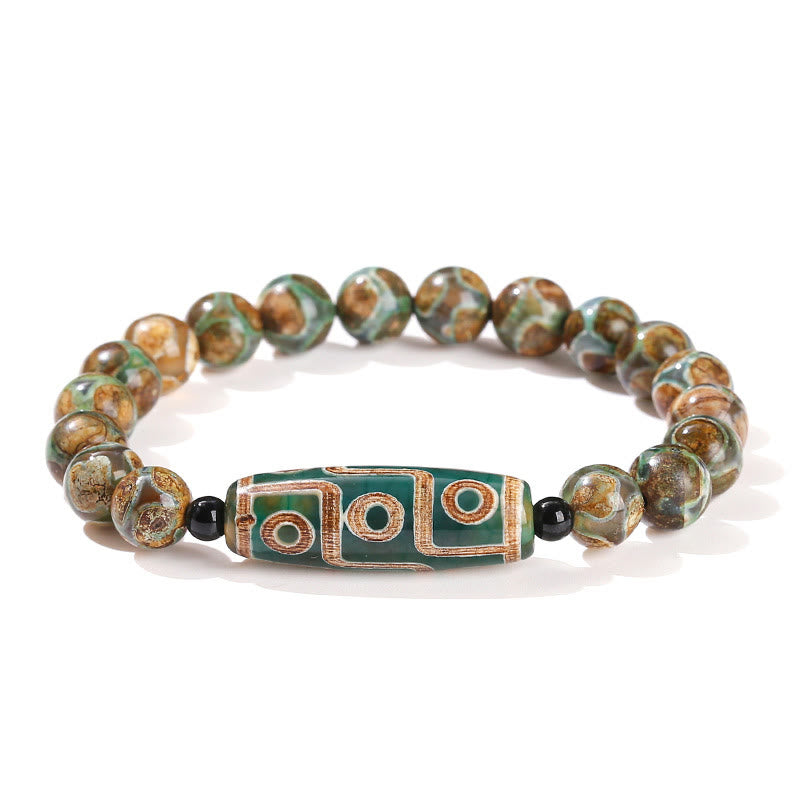 Bracelet de protection spirituelle tibétain en perles dzi à neuf yeux