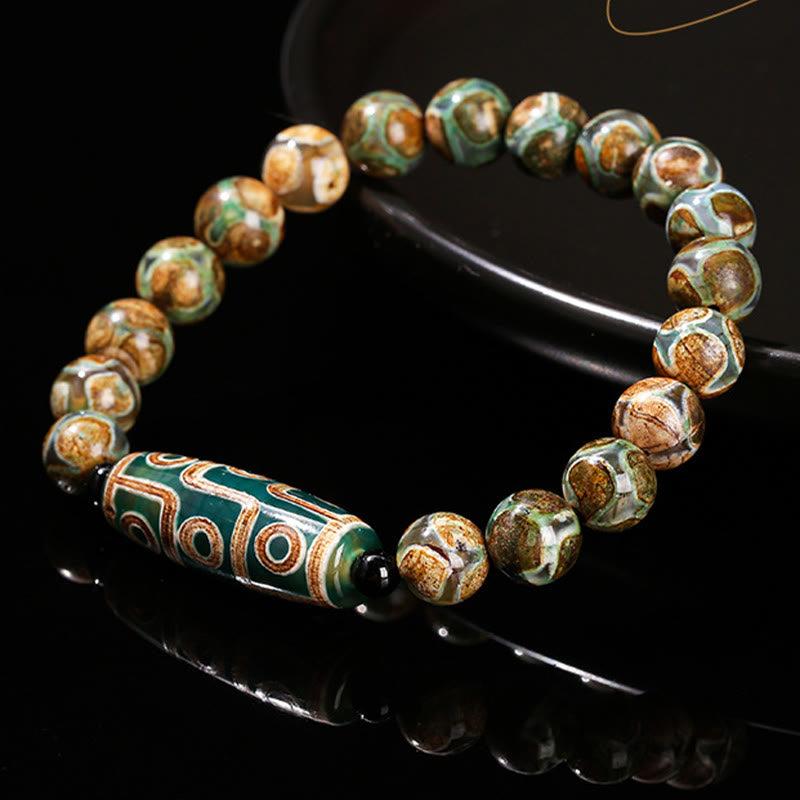 Bracelet de protection spirituelle tibétain en perles dzi à neuf yeux