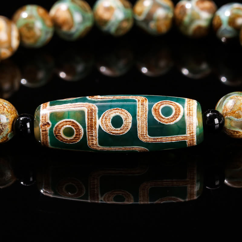 Bracelet de protection spirituelle tibétain en perles dzi à neuf yeux