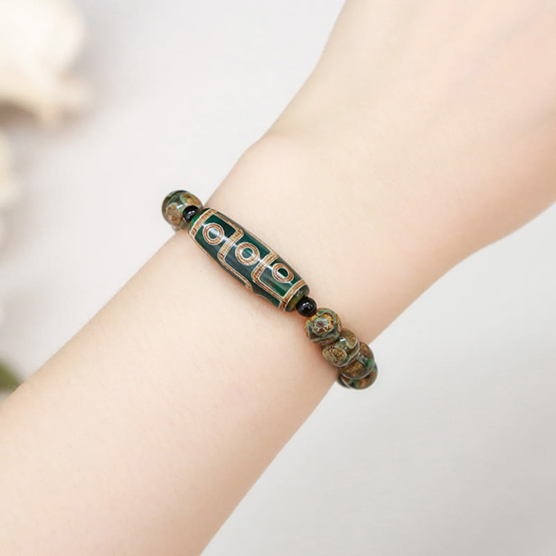 Bracelet de protection spirituelle tibétain en perles dzi à neuf yeux