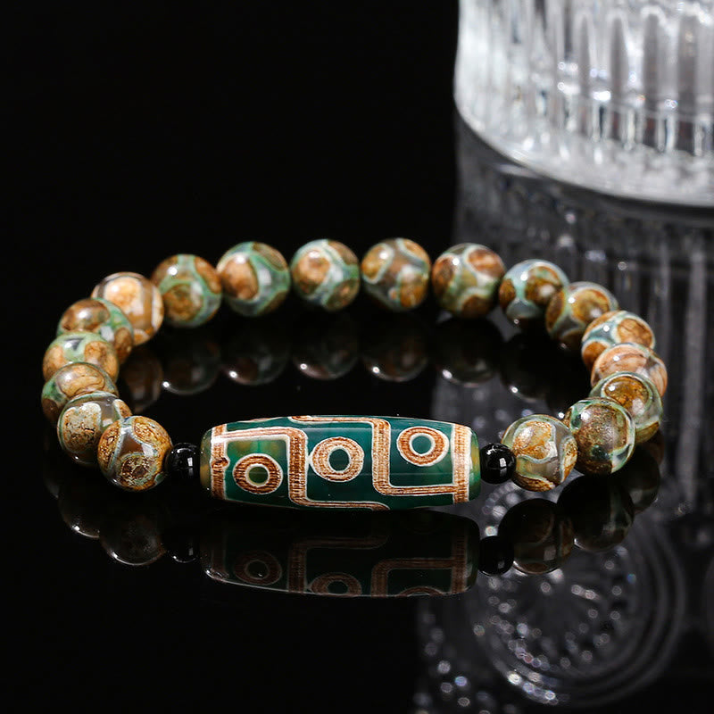 Bracelet de protection spirituelle tibétain en perles dzi à neuf yeux