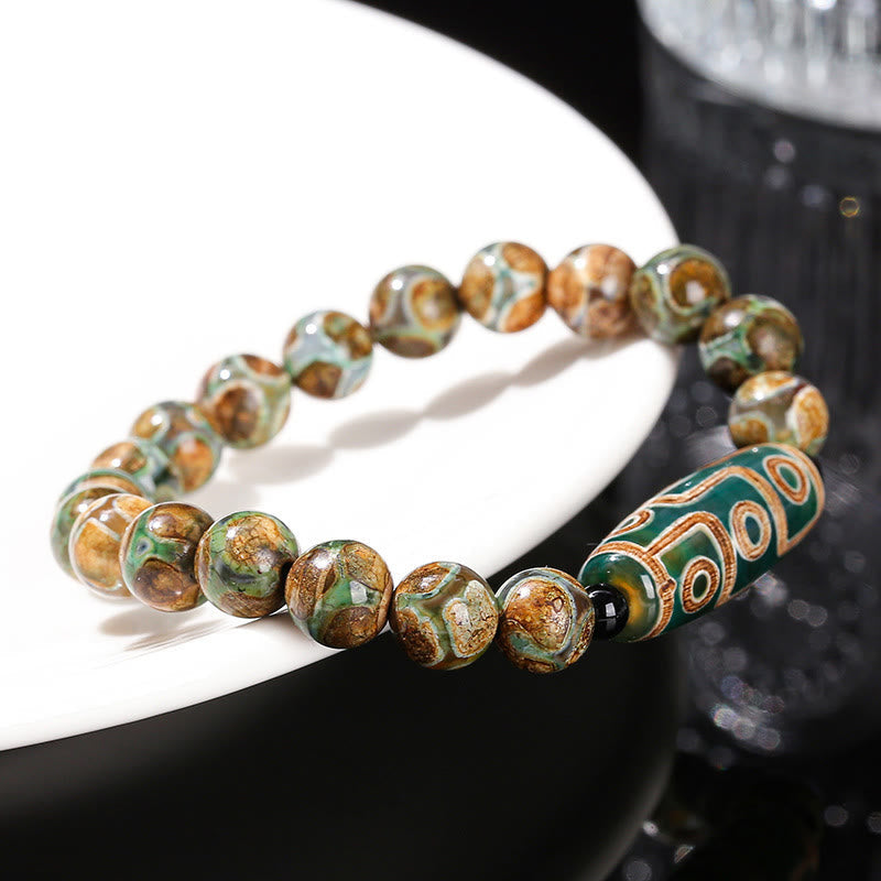 Bracelet de protection spirituelle tibétain en perles dzi à neuf yeux