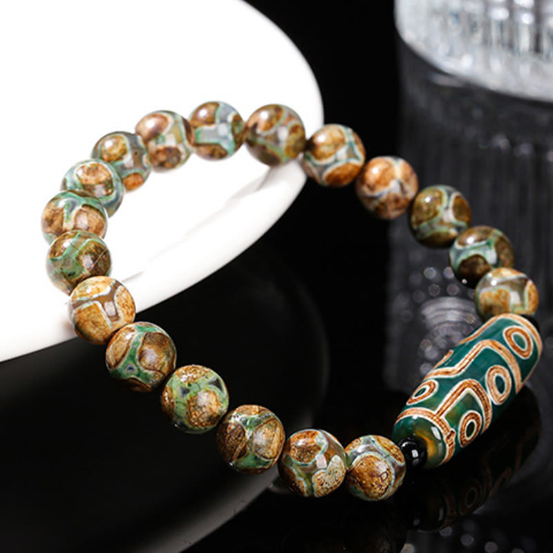 Bracelet de protection spirituelle tibétain en perles dzi à neuf yeux