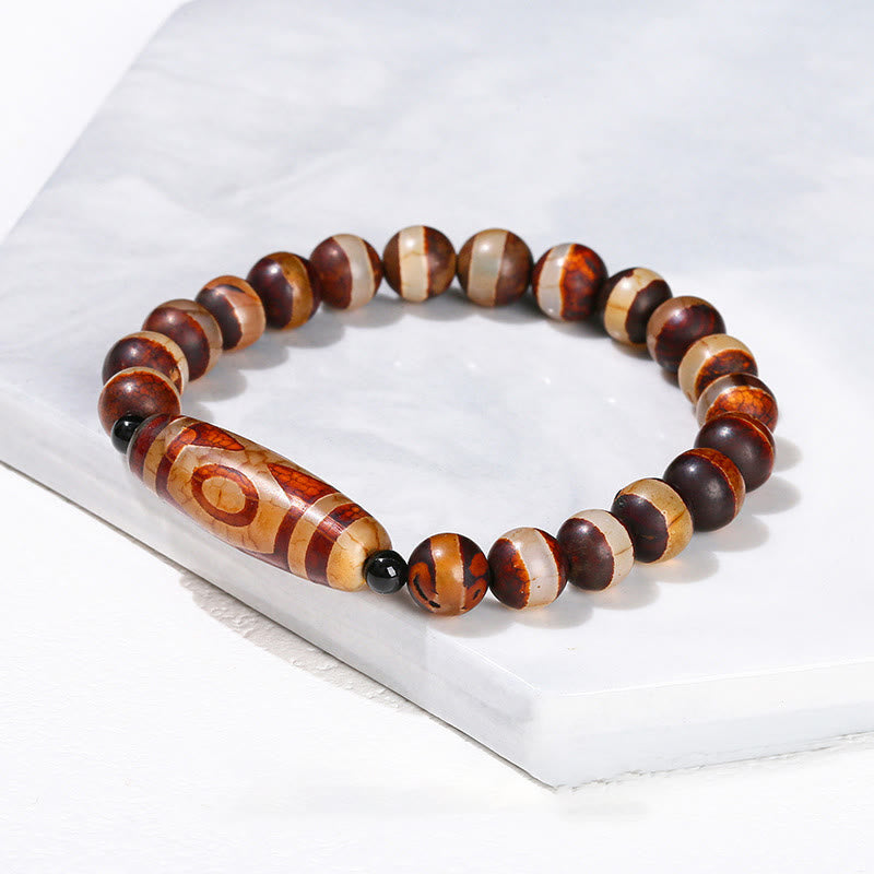 Bracelet de protection spirituelle tibétain en perles dzi à neuf yeux