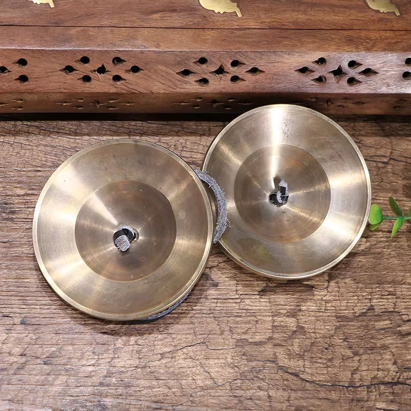 Pair of metallic Tibetan Tingsha cymbals for meditation and sound healing