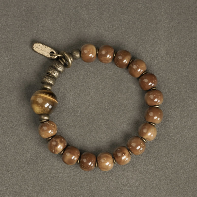 Bracelet de richesse en obsidienne œil de tigre et or brillant Kuka Seed