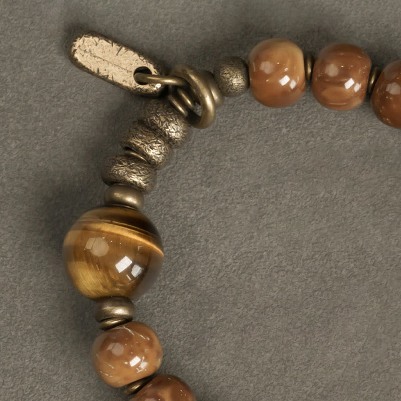 Bracelet de richesse en obsidienne œil de tigre et or brillant Kuka Seed