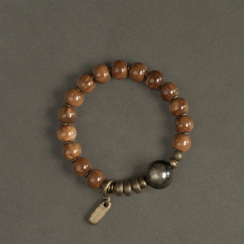 Bracelet de richesse en obsidienne œil de tigre et or brillant Kuka Seed