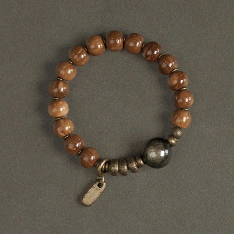 Bracelet de richesse en obsidienne œil de tigre et or brillant Kuka Seed