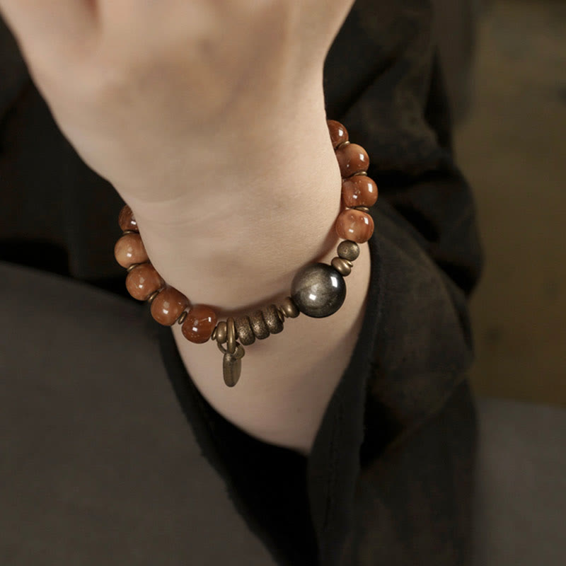 Bracelet de richesse en obsidienne œil de tigre et or brillant Kuka Seed