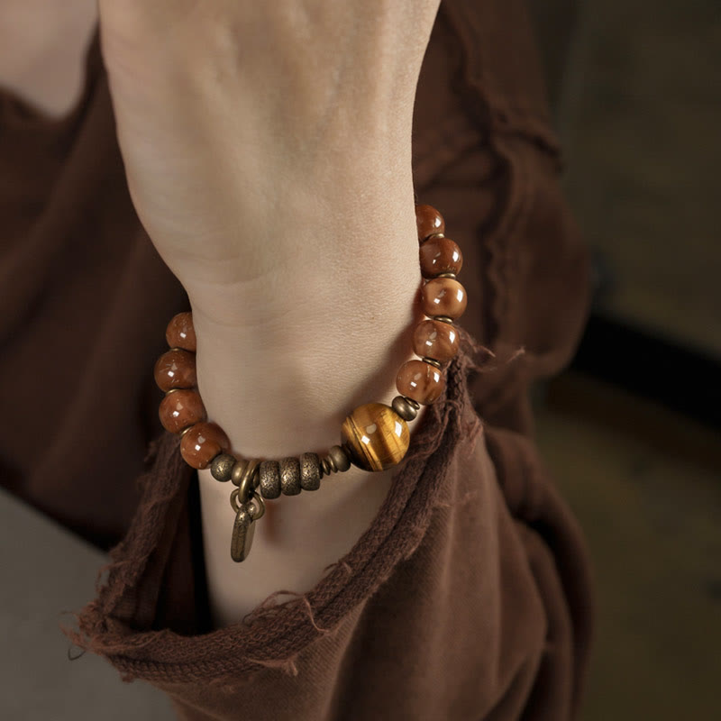 Bracelet de richesse en obsidienne œil de tigre et or brillant Kuka Seed