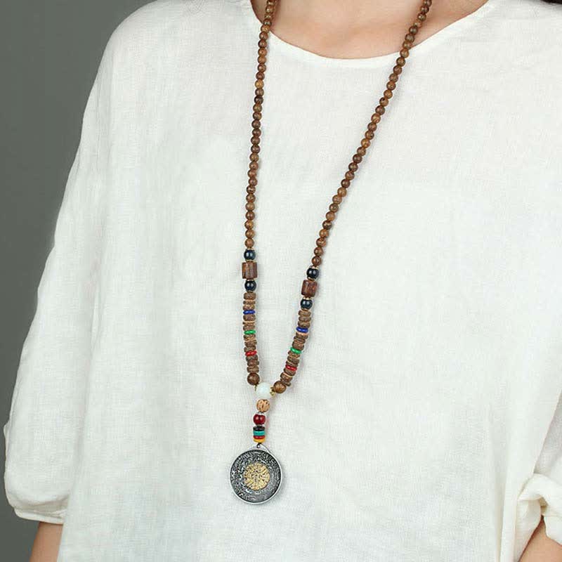 Collier roue de prière turquoise Om Mani Padme Hum