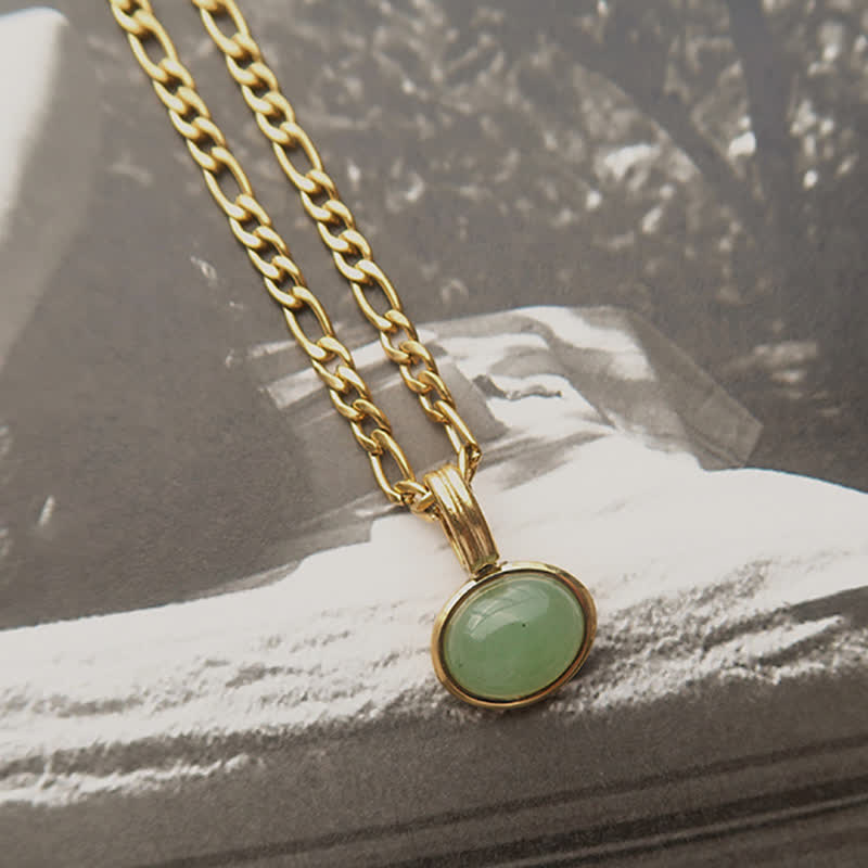 Collier pendentif ovale turquoise en acier titane