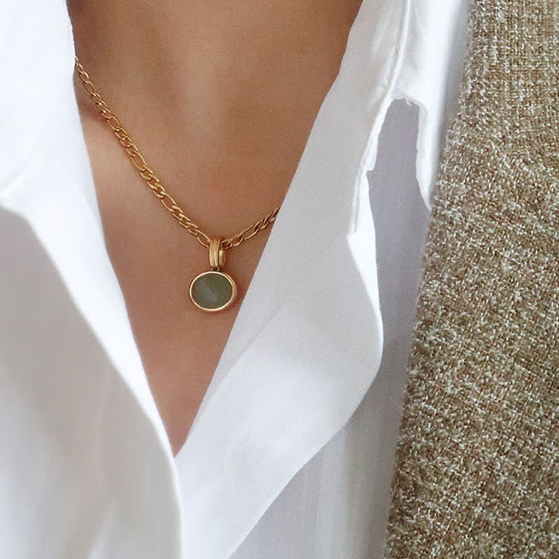 Collier pendentif ovale turquoise en acier titane