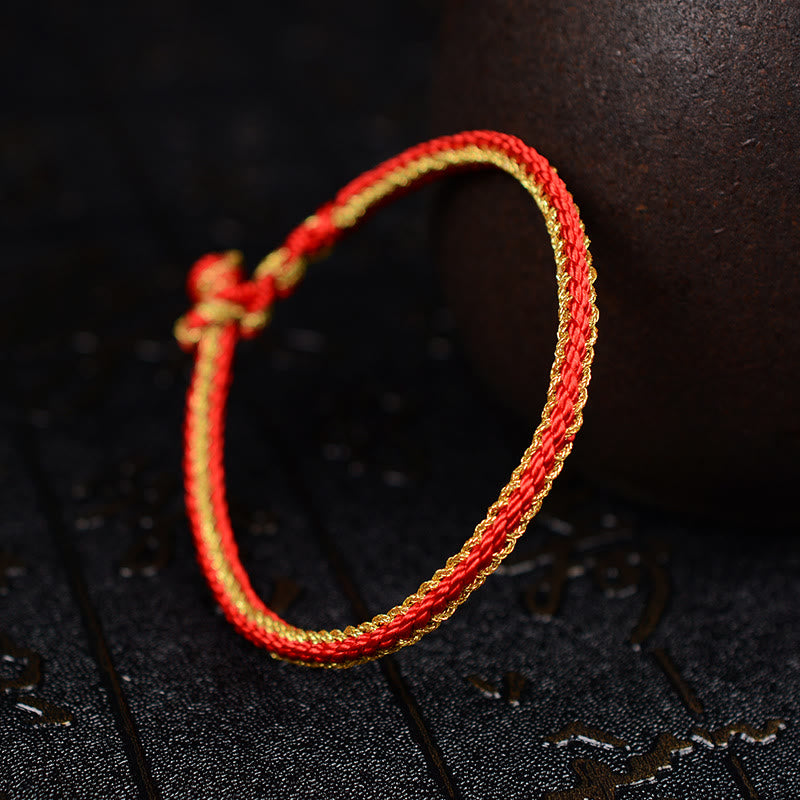 Bracelet bicolore artisanal à huit fils avec nœud de paix rouge