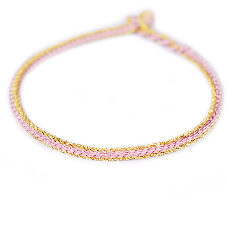 Bracelet bicolore artisanal à huit fils avec nœud de paix rouge