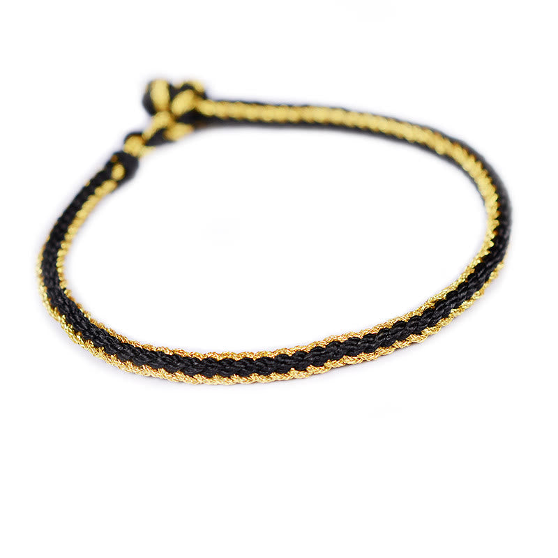 Bracelet bicolore artisanal à huit fils avec nœud de paix rouge