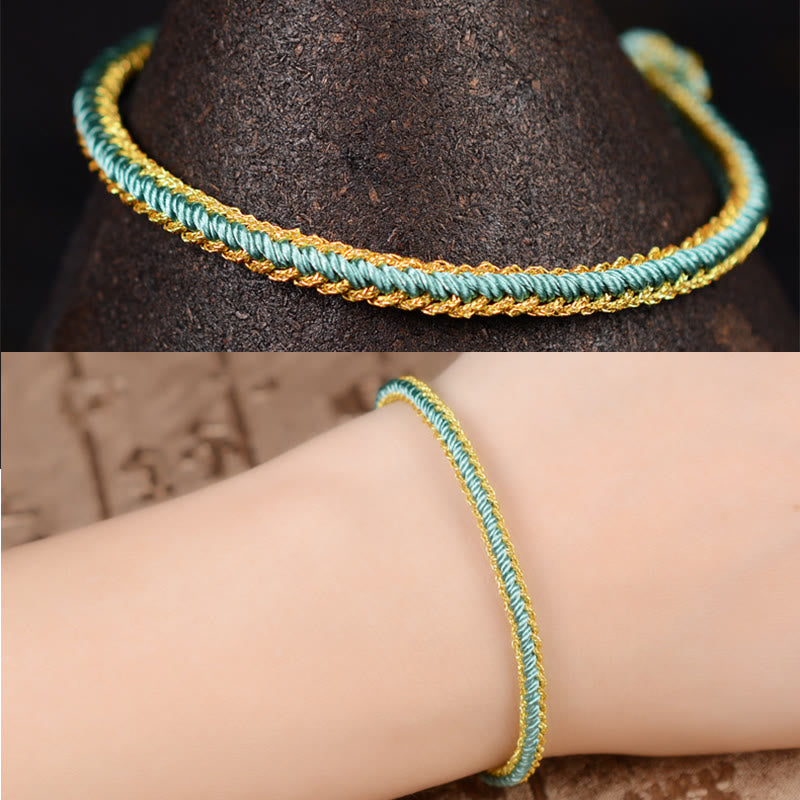 Bracelet bicolore artisanal à huit fils avec nœud de paix rouge