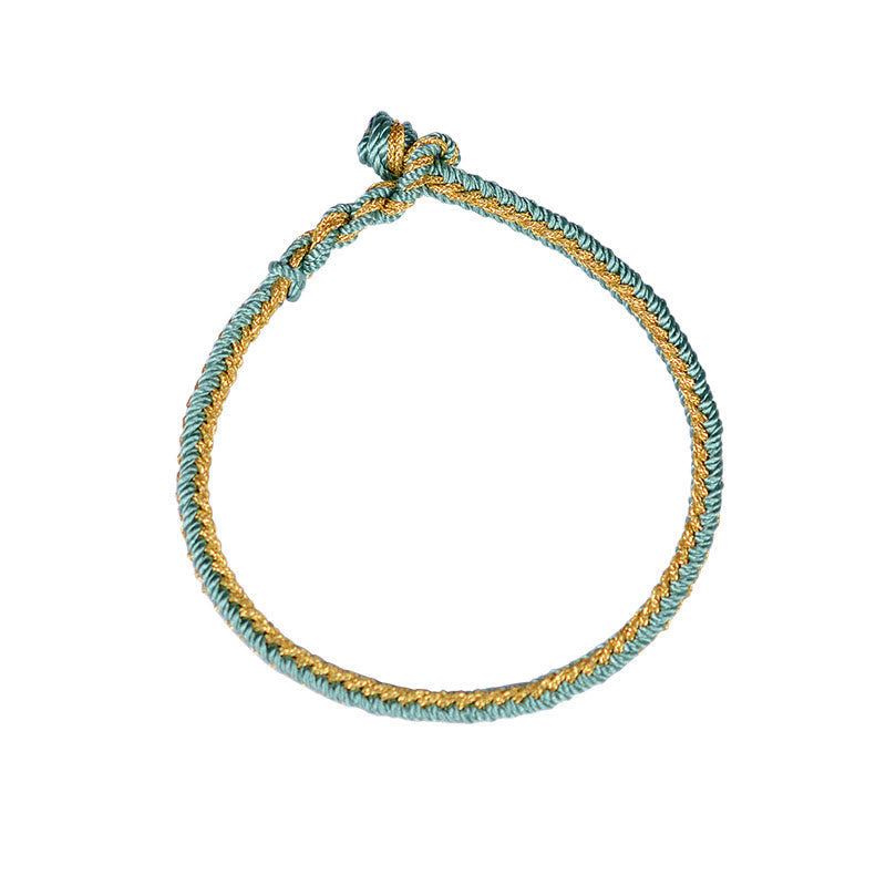 Bracelet bicolore artisanal à huit fils avec nœud de paix rouge