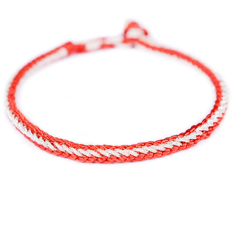Bracelet bicolore artisanal à huit fils avec nœud de paix rouge