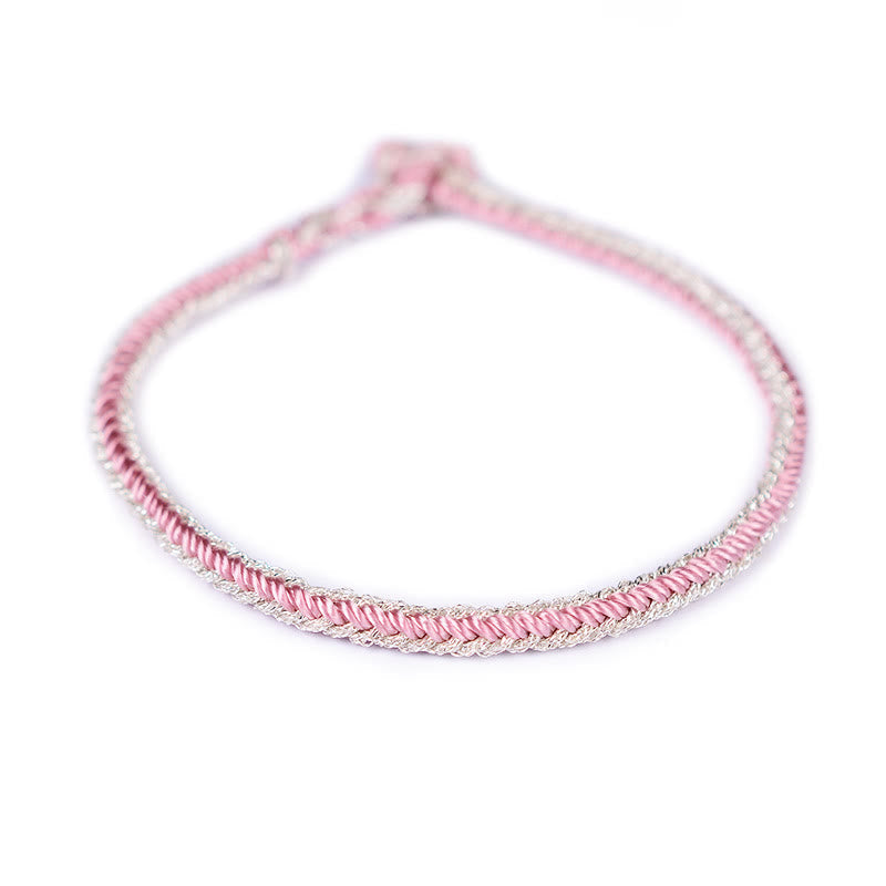 Bracelet bicolore artisanal à huit fils avec nœud de paix rouge